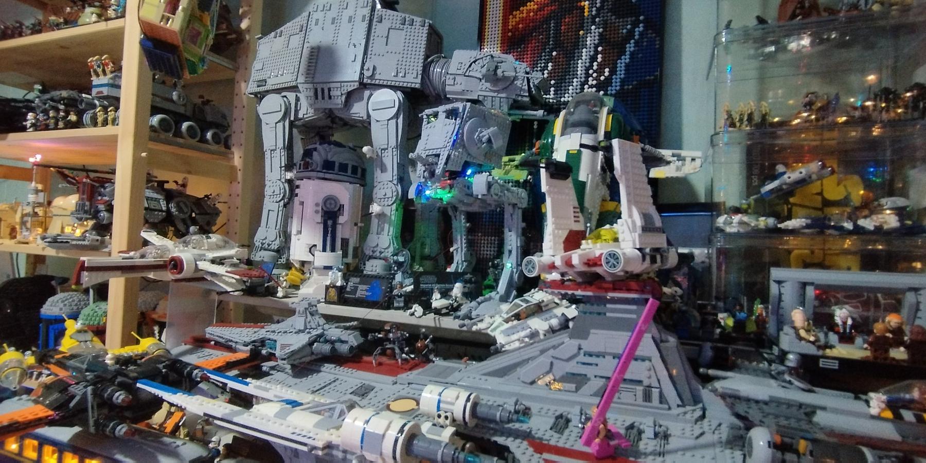 A crowded shelf of grey AT-AT walkers and starships built from bricks